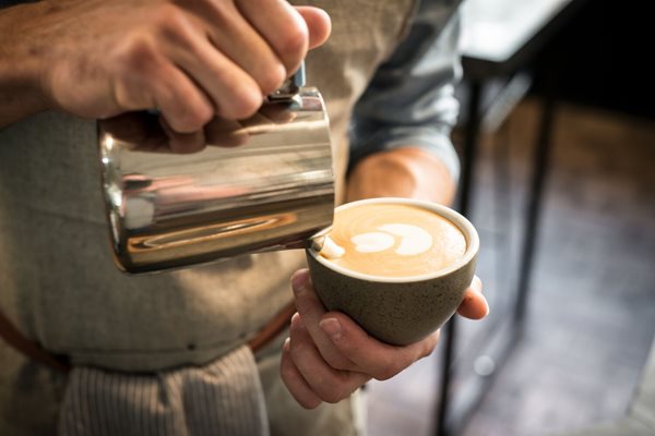 Pouring latte art.